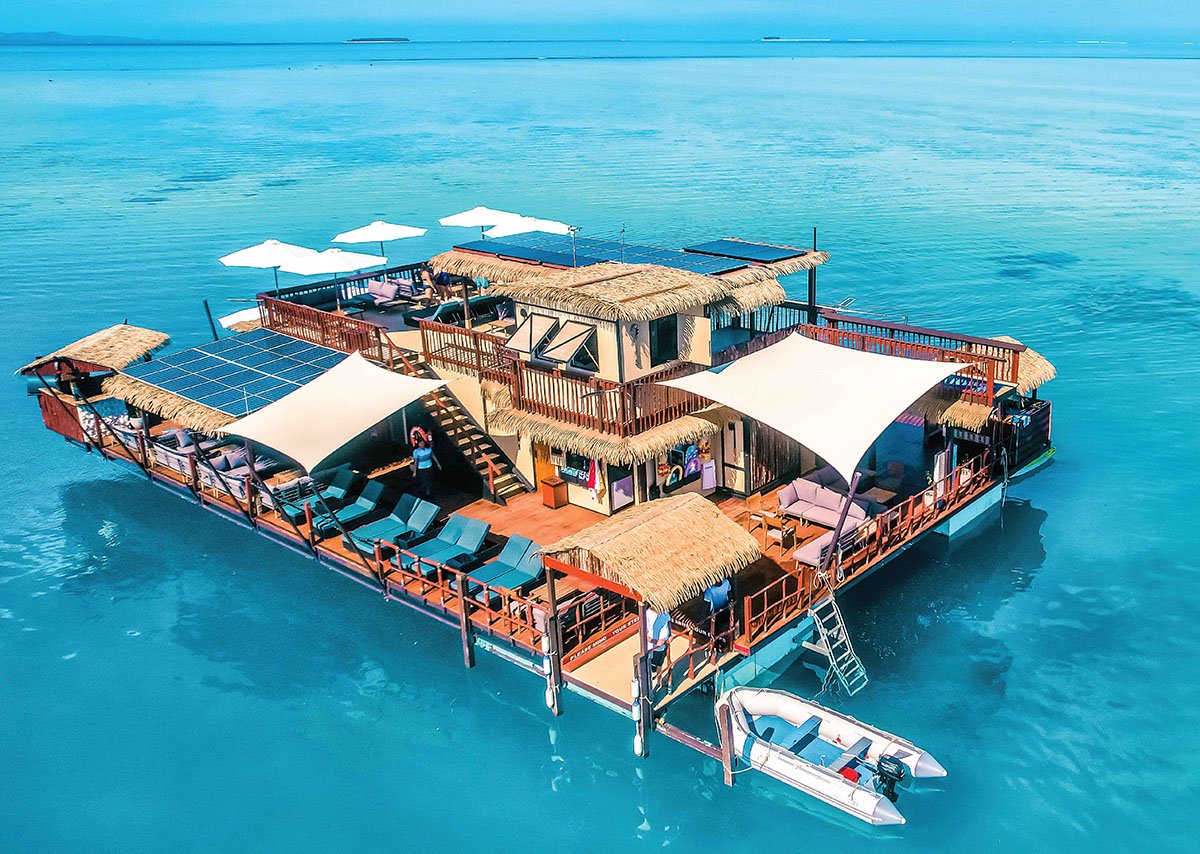 The Seventh Heaven floating pontoon on open turquoise water in Fiji's Mamanuca Islands